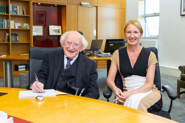 Former President Higgins signs SETU's visitor book with Prof. Campbell. Photo credit: Patrick Browne