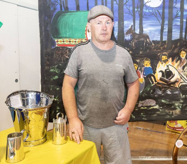 Stephen Faulkner with some of his handcrafted buckets,at Traveller Pride. Photo: Joe Evans