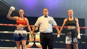 <p>Zara Breslin (left) after she won her first professional bout against Poland’s Joanna Fraszczak. Also pictured is referee Paul McCullagh.</p>