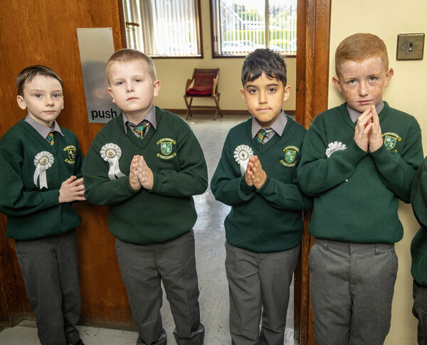  Pupils of Scoil Lorcain waiting to receive their First Holy Communion.