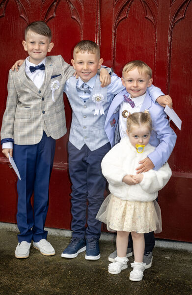  Josh McDonald, Kevin Morrissey and Gary Burke with Aylah Burke, St. Declan's, who received their First Holy Communion at St. John's Church.