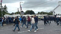 DUP MP defends photo with masked men at Scarva protest