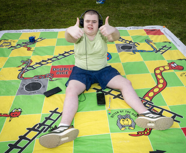 Tommy enjoyed a game of Snakes & Ladders. Tommy enjoyed a game of Snakes & Ladders.