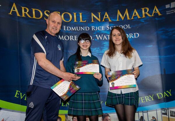 Robin Connelly Caylin O'Neill who were nominated as JPOY in Chess. Overall JPOY was Robyn Connolly. Included is Mr. Cleary presenting. Photo: John Power