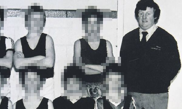 Bill Kenneally with a young basketball team in 1984 Bill Kenneally with a young basketball team in 1984