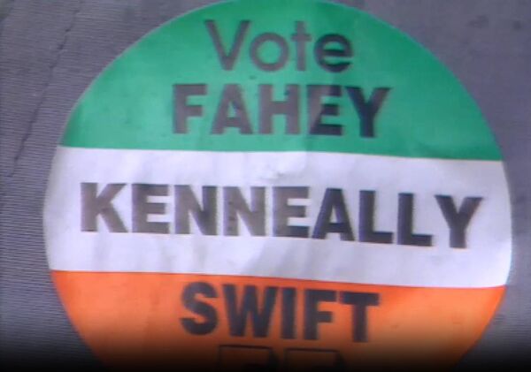 A badge from the 1989 General Election showing the Kenneally name. The Kenneally family were a political dynasty probably unparallel in Irish political life. A badge from the 1989 General Election showing the Kenneally name. The Kenneally family were a political dynasty probably unparallel in Irish political life.