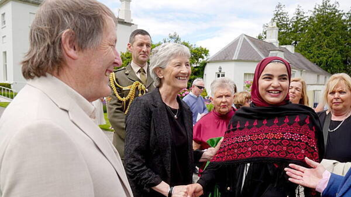 Cowboy hats and summer dresses at President’s first garden party