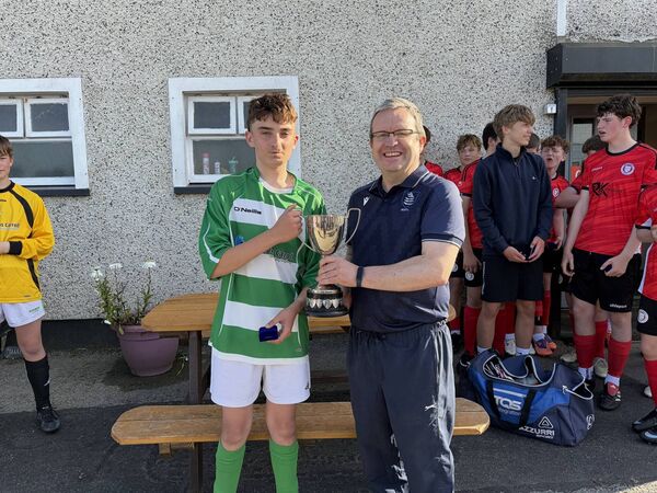 Villa captain Dylan Farrell receives the WSFL Waterford FC Under 15C Cup from league chairman Davy Cullen. Villa captain Dylan Farrell receives the WSFL Waterford FC Under 15C Cup from league chairman Davy Cullen.