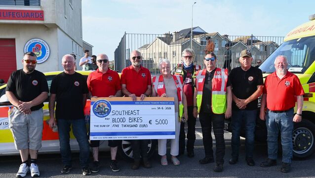 Motorbike enthusiasts present cheques following successful fundraiser in Waterford