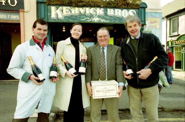 Siobhan Fitzgerald, who bought her Emerald Christmas Tree from Kervick's, Ballybricken, won a case of champagne as her entry was chosen as the winner, picture shows, from left, Tom Kervick, Siobhan Fitzgerald, winner, Freddie Kervick and David Hasslacher back in 2000.