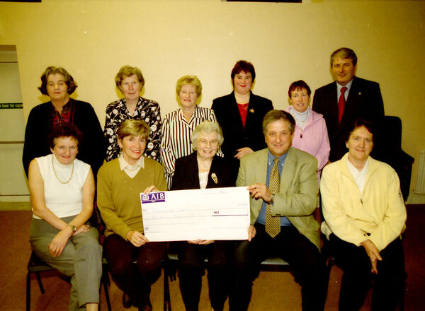  The Ferrybank Support Group presented a cheque for £5,000 to Waterford Hospice Movement back in 2000. Pictured were, front, Mary McGrath, Susan Burtchaell, Helen Walsh, Tony Kavanagh, Chairman, Hospice, and Kay Dowling. Standing, Sadie Hartley, Ellen Heffernan, Cathleen Williams, Lyla Carew, Peggy Turner, and Des Kelly, Hospice.