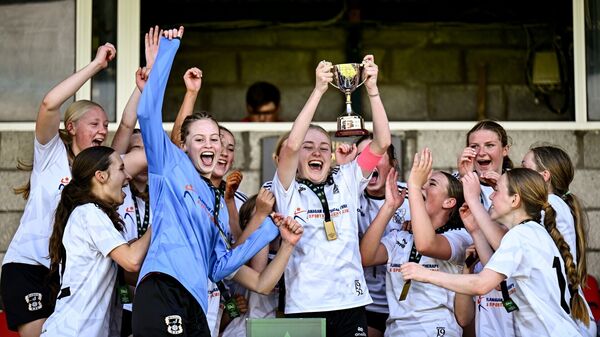 Tramore captain Brooke Power lifts the cup alongside her teammates after the FAI Women's U17 Cup final success over Carrigaline United.