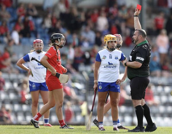 Waterford’s Niamh Rockett is shown a red card by referee Donnacha O Callaghan during the Glen Dimplex All-Ireland Camogie Championship clash played at Pairc Ui Rinn on Sunday last. Photos: INPHO/Stephen Heaney 