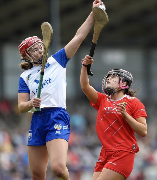 Waterford’s Clodagh Carroll catches the ball ahead of Cork’s Emma Murphy.