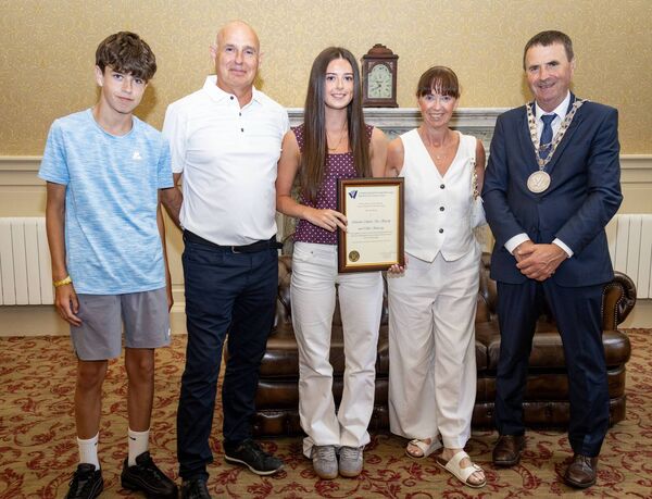 Mayor of Waterford City & County Cllr Liam Brazil presents a scroll to Chloe Hennessy and her family. Photo: Joe Evans Mayor of Waterford City & County Cllr Liam Brazil presents a scroll to Chloe Hennessy and her family. Photo: Joe Evans
