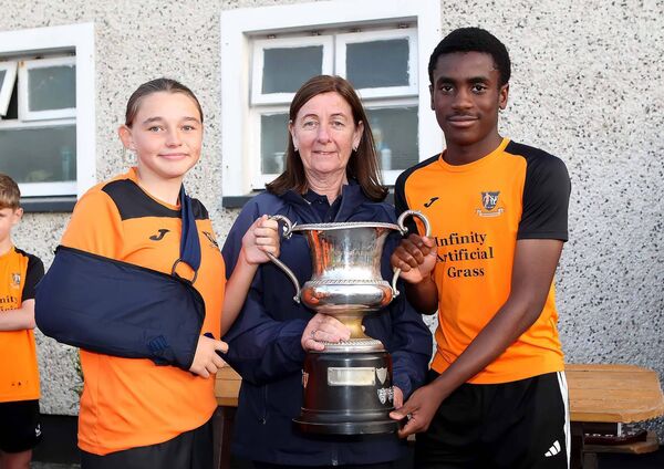 Mary Ray, WSFL presents the Johnny Barnes Memorial U13A Cup to joint Southend captains, the injured Emily O'Regan and Fareed Alabi. Mary Ray, WSFL presents the Johnny Barnes Memorial U13A Cup to joint Southend captains, the injured Emily O'Regan and Fareed Alabi.