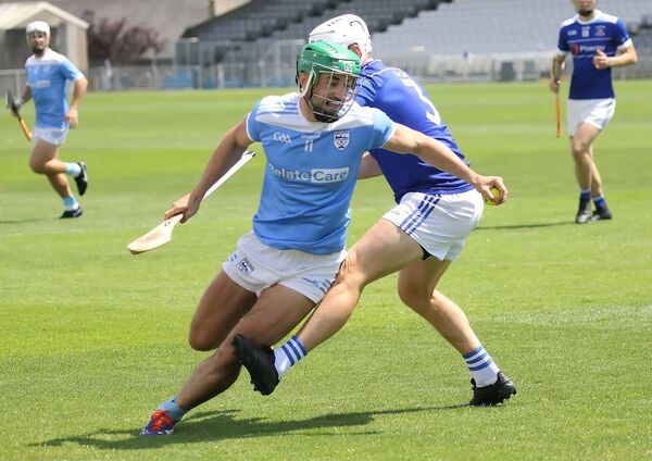Roanmore's Shane Mackey skips past the attempted tackle from Mount Sion's Stephen O'Neill. Roanmore's Shane Mackey skips past the attempted tackle from Mount Sion's Stephen O'Neill.