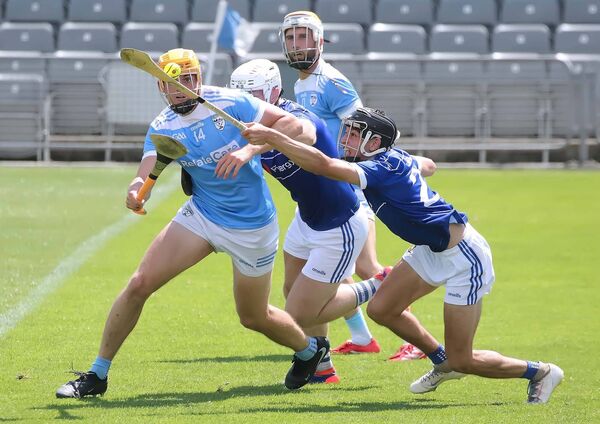 Roanmore's Rory Furlong has the sliotar stolen from him by Mount Sion's Aaron Coughlan. Roanmore's Rory Furlong has the sliotar stolen from him by Mount Sion's Aaron Coughlan.