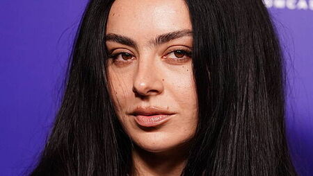 Charli XCX steps onto film set with Vincent Cassel in new music video