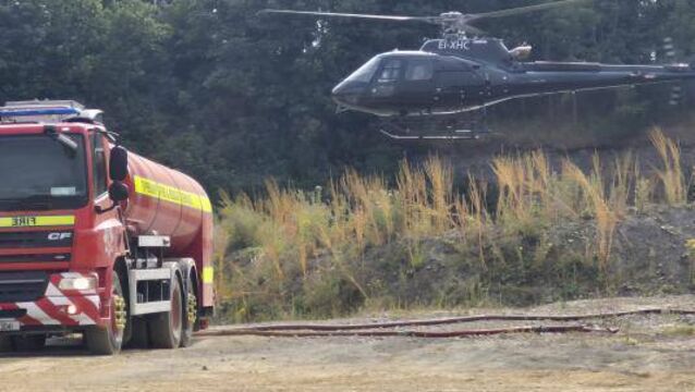 <p>Fire Tanker and helicopter at Slievenamon Photo credit Tipperary County Council </p>