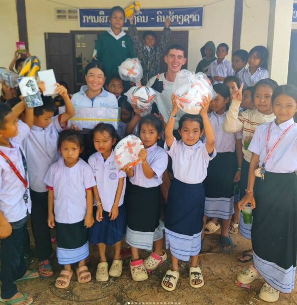Mickey using some of the funds raised to buy footballs for children in Vietnam. Picture: Cycle for Owen on Instagram Mickey using some of the funds raised to buy footballs for children in Vietnam. Picture: Cycle for Owen on Instagram