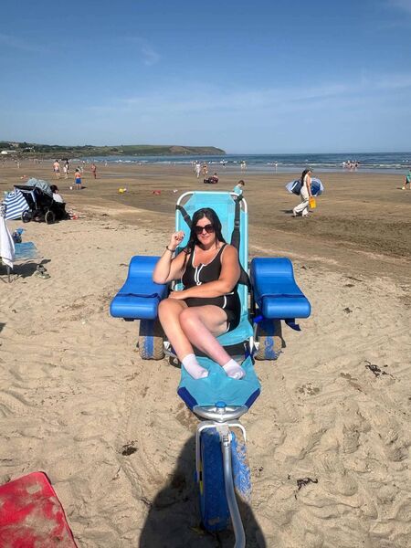 Samantha trying out the new amphibious beach wheelchair at Clonea Beach
