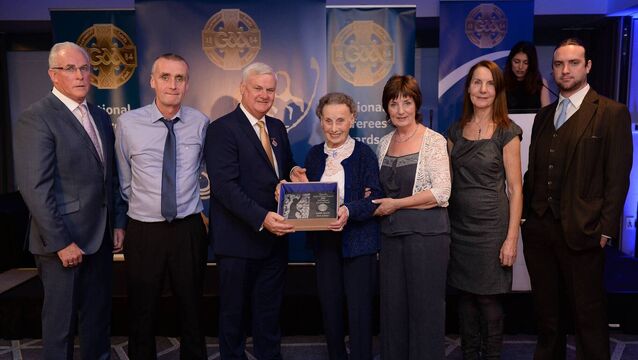 <p>Family members of the late referee Willie Walsh, Waterford, who refereed a total of nine All-Ireland Finals, including seven hurling and two football, grandson Seán Walsh, second from left, daughter Ita Power, fourth from left, granddaughter Máiréad Bourke, fifth from left, granddaughter Ursula Kenny, sixth from left, and great-grandson Neil Bourke, far right, accept the Hall of Fame Referee Presentation from Uachtarán Aogán Ó Fearghail, third from left, and Seán Walsh, far left, Chairman of National Referee Development Committee, at the GAA National Referees' Awards Banquet 2016 at Croke Park in Dublin. Photo: Sportsfile/Cody Glenn</p>