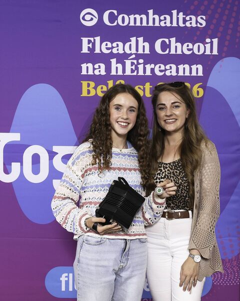 Mary Ní Dheagh of CCÉ Craobh na gComarach, Port Láirge, 3rd place All Ireland Winner for the Concertina (15-18 years) at the 2026 Comhaltas Ceoltóirí Éireann All Ireland Fleadh Cheoil in Belfast. Pictured here with her teacher Clara. Photo: Anna Allen Photography Mullingar