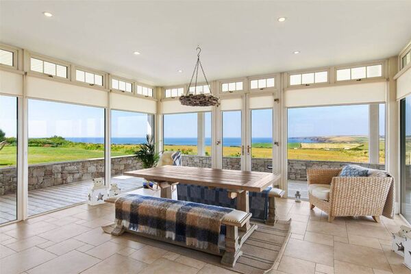 French doors open directly onto the veranda, blurring the line between indoors and out French doors open directly onto the veranda, blurring the line between indoors and out