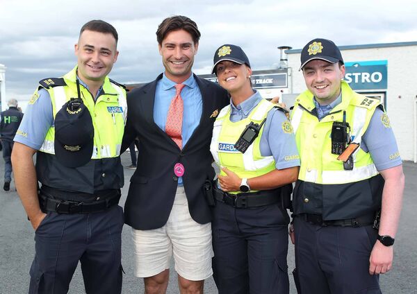 Frankie Foster from Raceday TV pictured with some local Tramore Gardai at Tramore Racecourse.