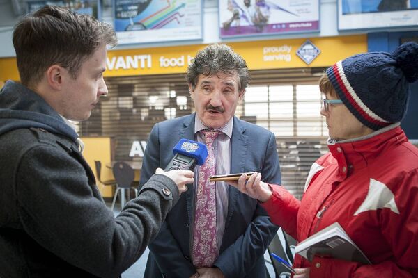 Minister John Halligan speaking with reporters Marion O'Mara , Waterford News &amp; Star and Anthony Phelan, WLRfm, at Waterford Airport. Photo: Joe Evans