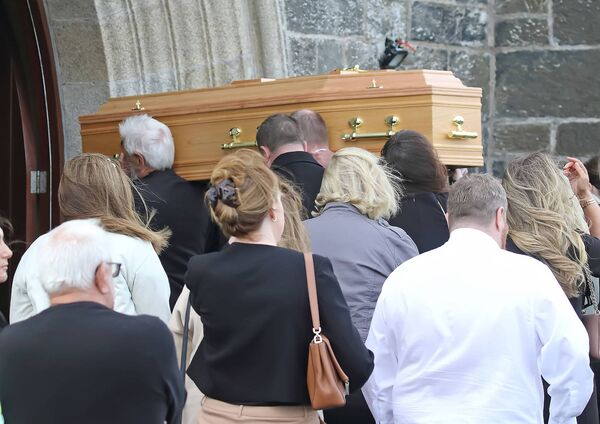 The remains of Waterford News & Star journalist Marion O'Neill are carried into the Holy Cross Church, Tramore. The remains of Waterford News & Star journalist Marion O'Neill are carried into the Holy Cross Church, Tramore.
