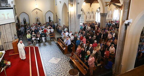 Hundreds gather in vigil for family injured in M9 crash