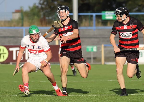 De La Salle's Conor Keane in possession against Ballygunner's Eoin Cuddihy. De La Salle's Conor Keane in possession against Ballygunner's Eoin Cuddihy.