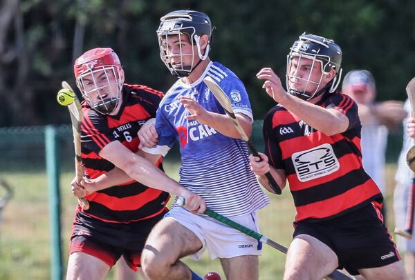Fourmilewater's Oran Sheehan is tackled by Ballygunner's Jeff Frampton and Daniel Purcell Fourmilewater's Oran Sheehan is tackled by Ballygunner's Jeff Frampton and Daniel Purcell