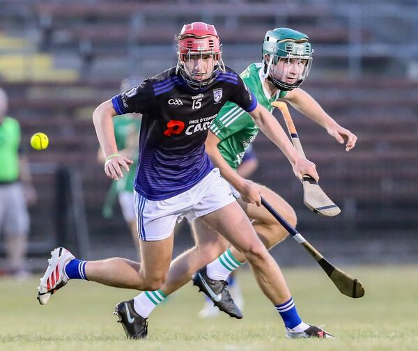 Fourmilewater's Eoin Lavery trys to win possession against Clonea's Stephen Hearne. Fourmilewater's Eoin Lavery trys to win possession against Clonea's Stephen Hearne.
