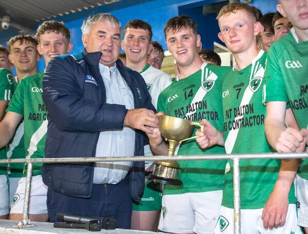 County Board Vice Chairman Brendan Tobin persents the cup to Clonea joint captains Billy Lynch and Daire Crotty after they defeated Fourmilewater in their J.J Kavanagh & Sons Division 2 Minor Co. Hurling Final County Board Vice Chairman Brendan Tobin persents the cup to Clonea joint captains Billy Lynch and Daire Crotty after they defeated Fourmilewater in their J.J Kavanagh & Sons Division 2 Minor Co. Hurling Final