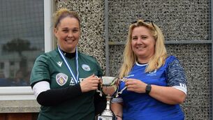 <p>Dungarvan captain Aimee Jordan receives the cup from Lynne Casey, WDWSL</p> <p>Dungarvan captain Aimee Jordan receives the cup from Lynne Casey, WDWSL</p>