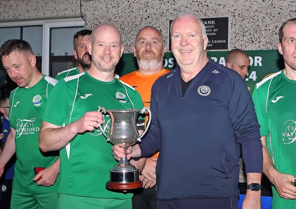 WDFL Chairman Damien Tiernan presents the Matt Stafford Cup to the Ferrybank captain John Purcell. WDFL Chairman Damien Tiernan presents the Matt Stafford Cup to the Ferrybank captain John Purcell.