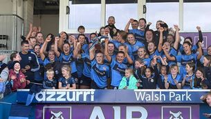 <p>Gailltír joint captains Alannah O'Sullivan and Maeve Sheridan lift the Senior A Camogie cup after their win over De La Salle at Azzurri Walsh Park.</p>
