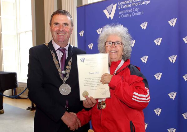 Mayor of Waterford City &amp; County, Cllr. Liam Brazil presents Carriglea Special Olympics Club member Sinead Power with her scroll. 	Photo: Noel Browne