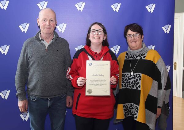 Carriglea Special Olympics Club member Hannah O'Mahony is pictured with her parents Michael and Marie Curran. 	Photo: Noel Browne