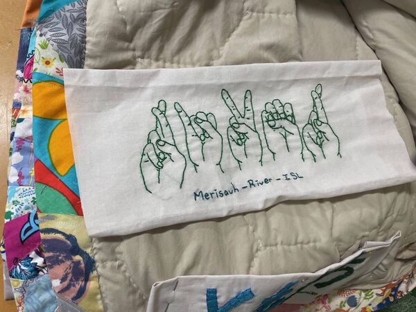 One member stitched the word 'river' in Irish Sign language. 